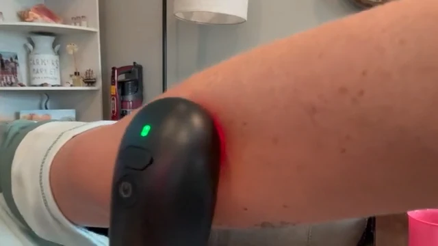 STOGA IRH-1 ceramic contact surface held against intact skin during an adult home demonstration